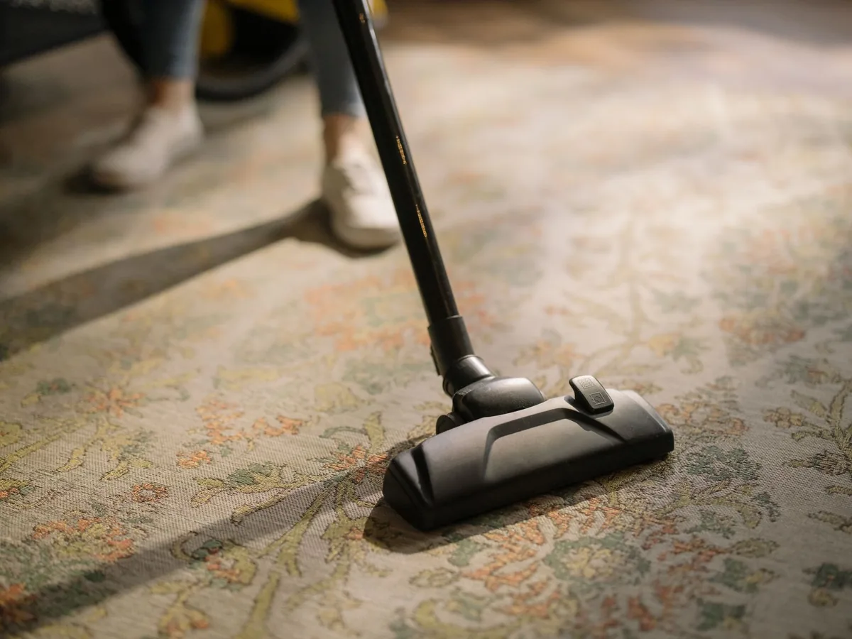 A commercial vacuum on office carpet