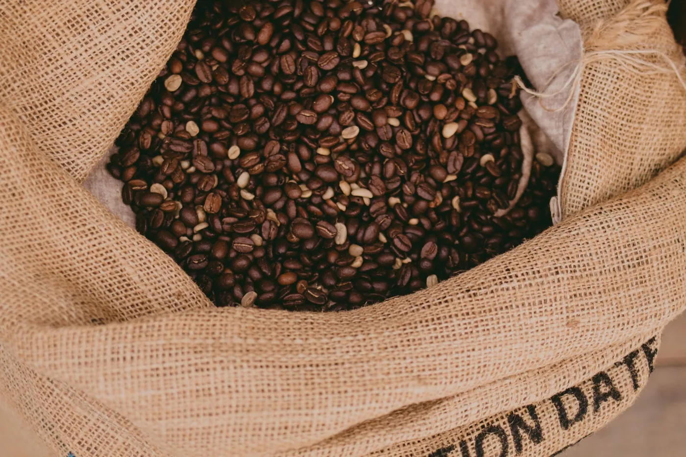 Green coffee beans in a sack