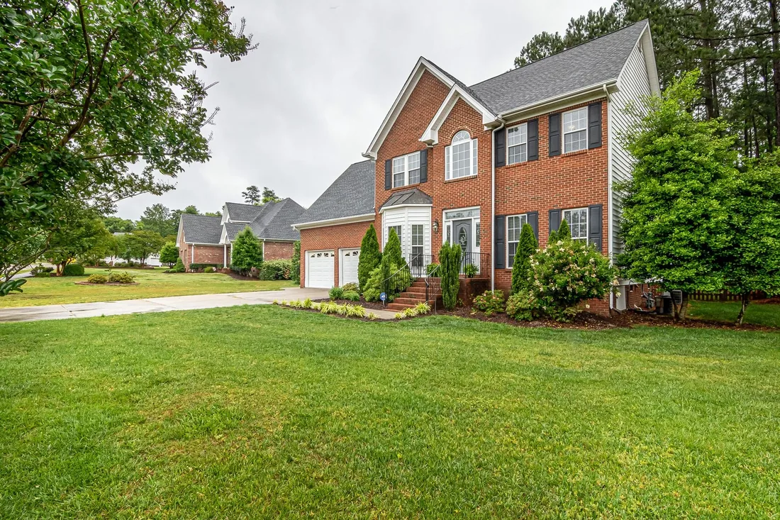 A family home with a clear front lawn