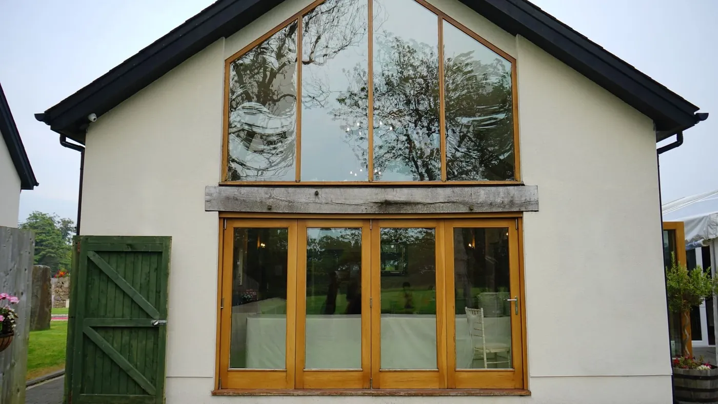 A finished gable extension with oak framed glazing and bifold doors