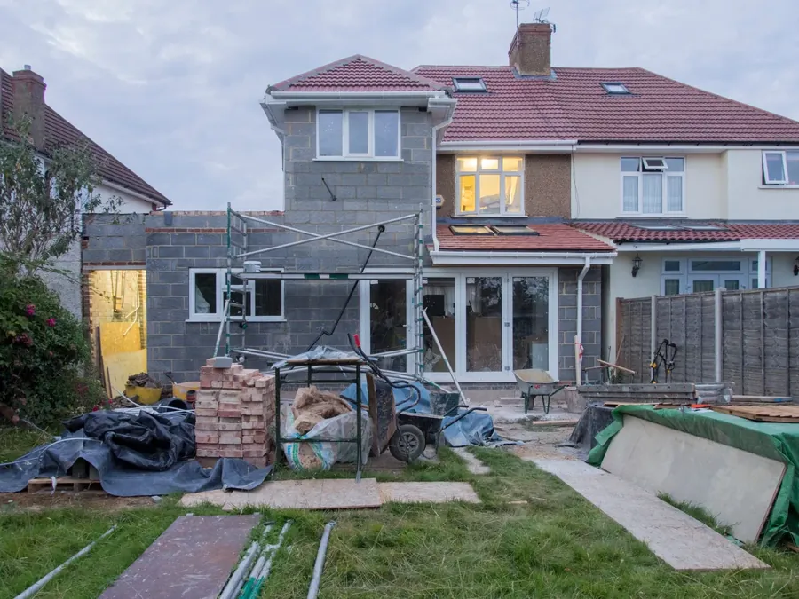 A two storey side and rear extension under scaffolding