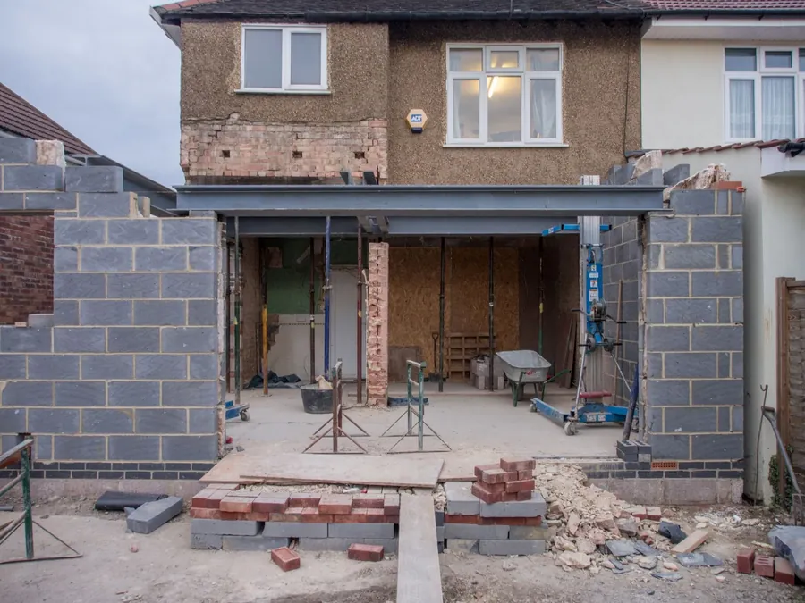 Blockwork walls rising on a rear extension