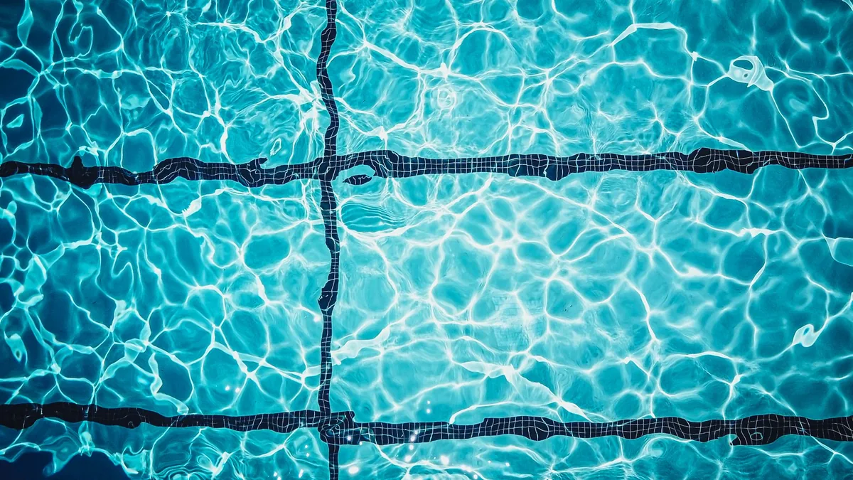 Pool tiles seen through clear water