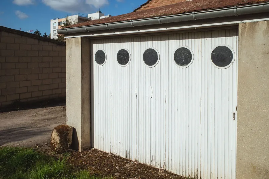 An old side garage with round windows