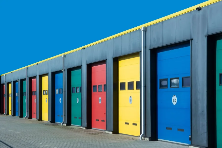 A row of coloured commercial doors