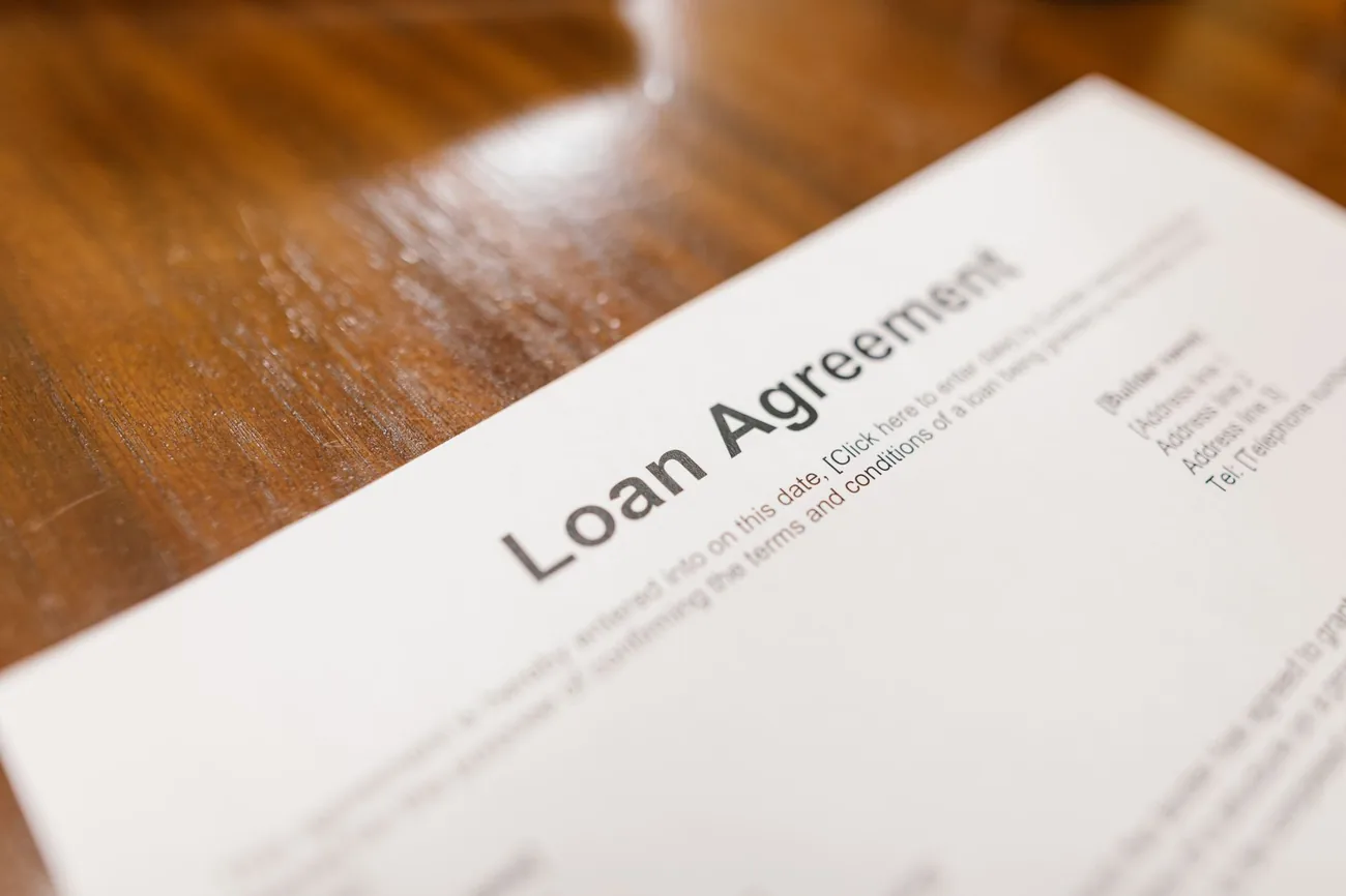 A loan agreement laid out ready to sign