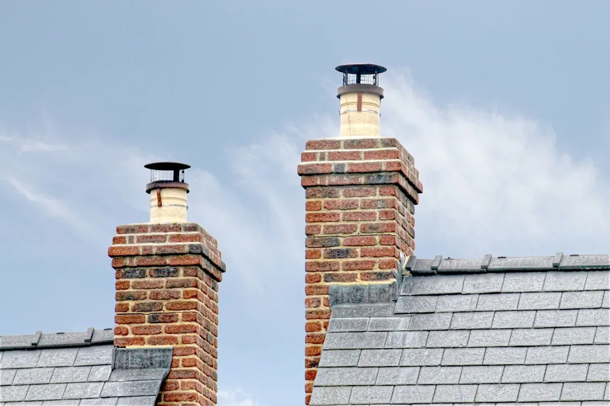 Brick chimney stacks on a slate roof