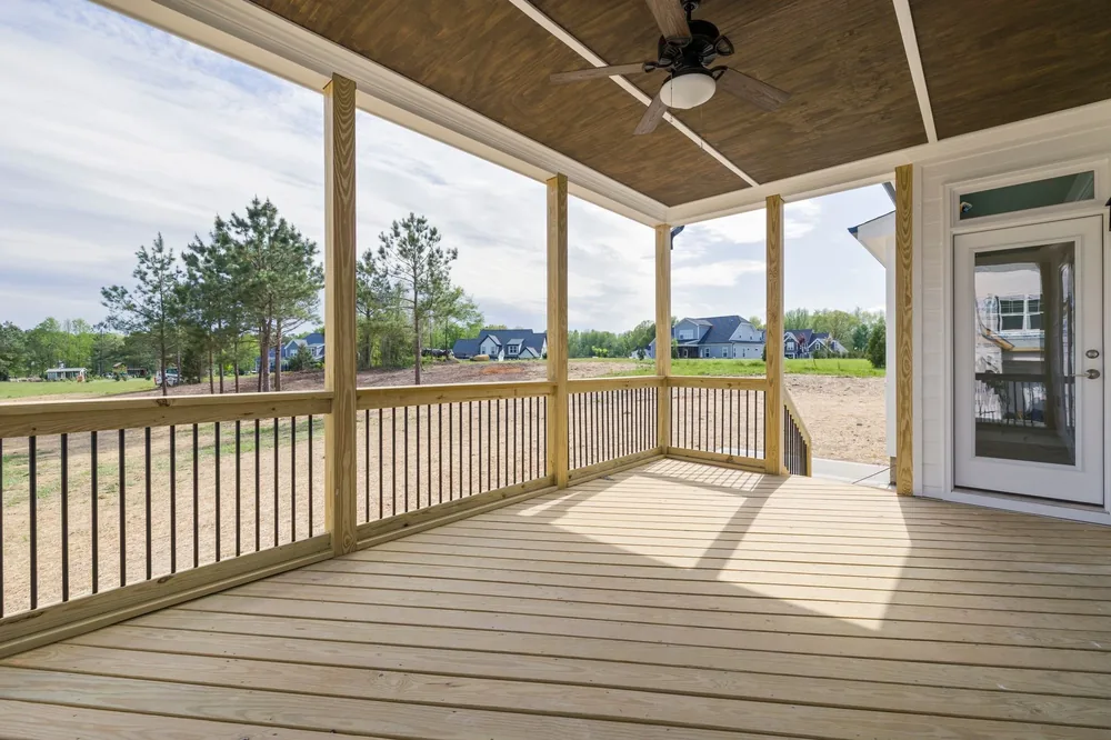 A covered deck with new railings