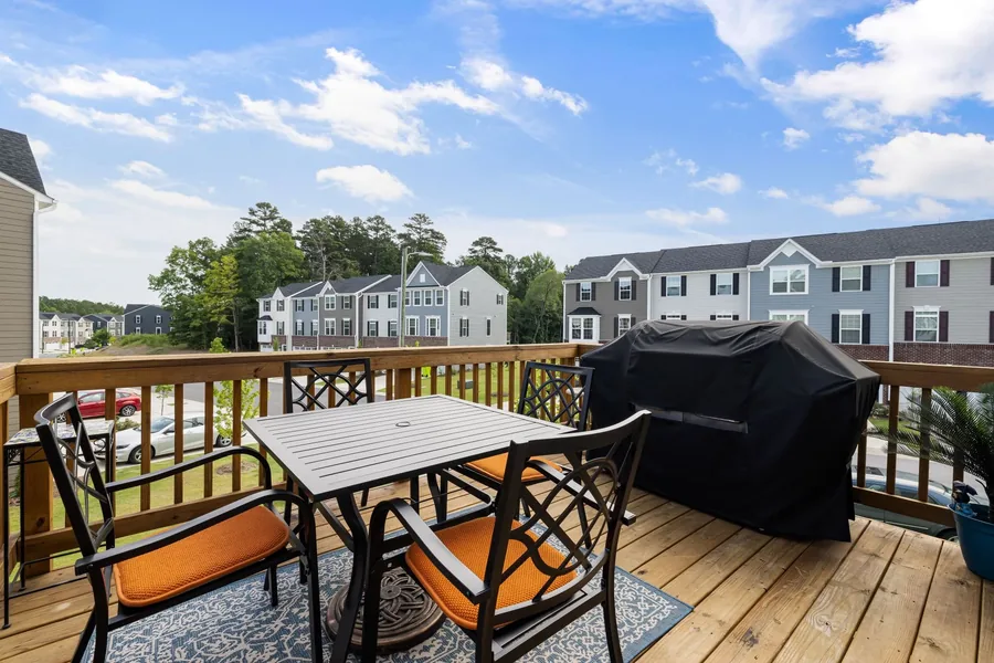A finished deck with a dining set