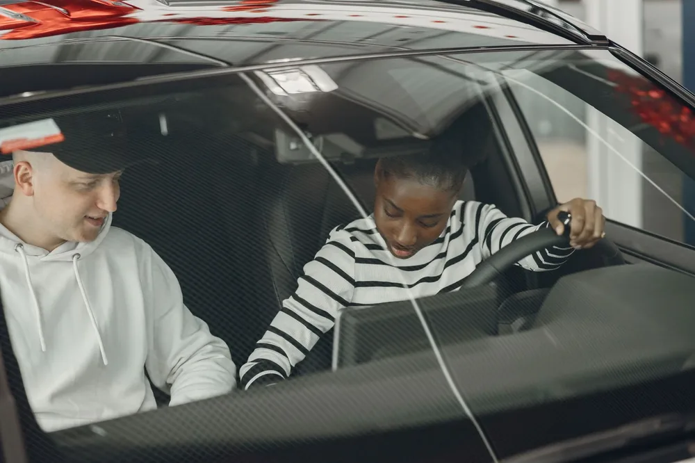 A learner practising with an instructor in the passenger seat