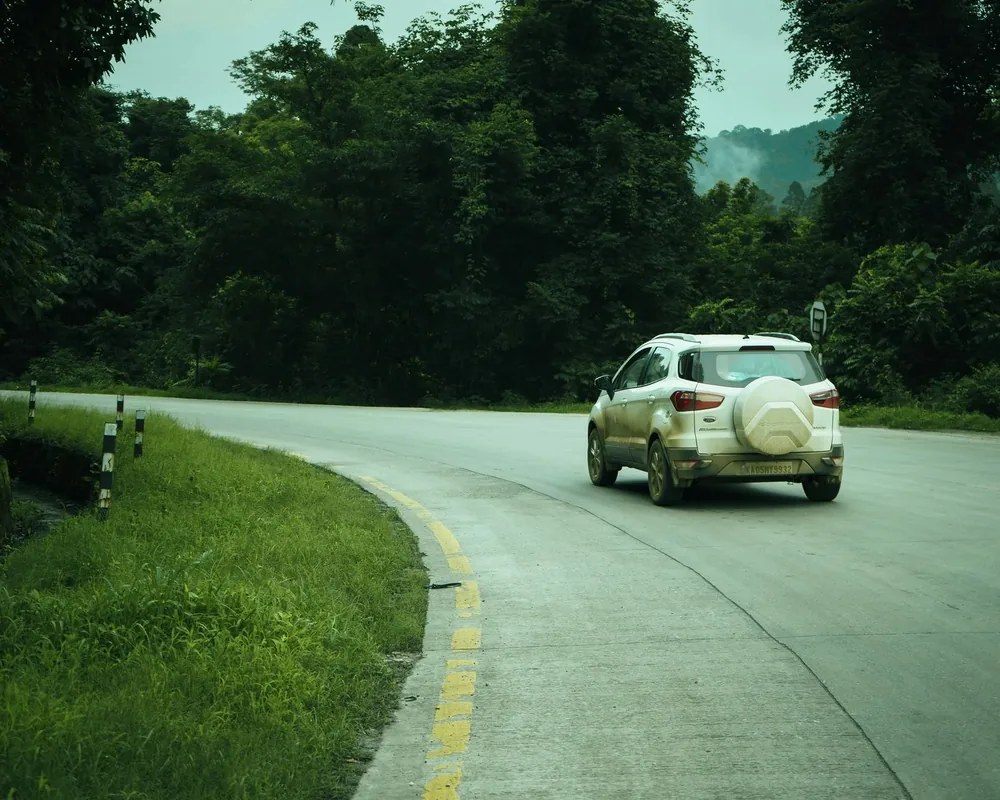 A car on a quiet curving road