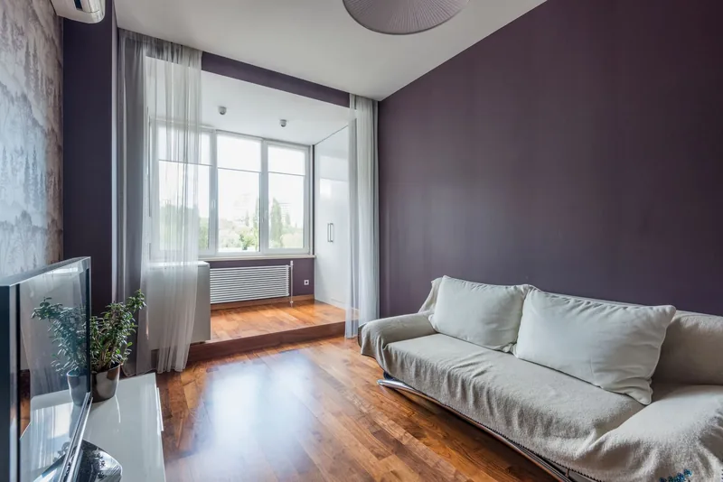 A dry, finished room with a wooden floor