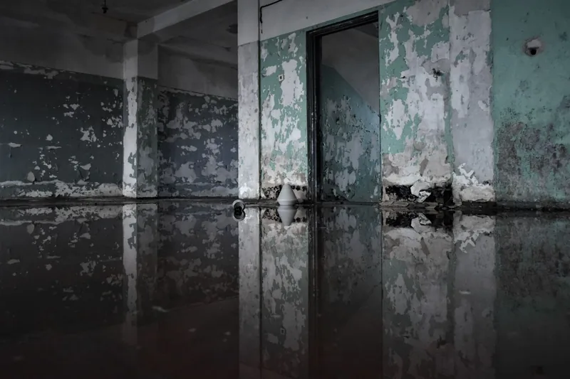 A flooded room with water on the floor