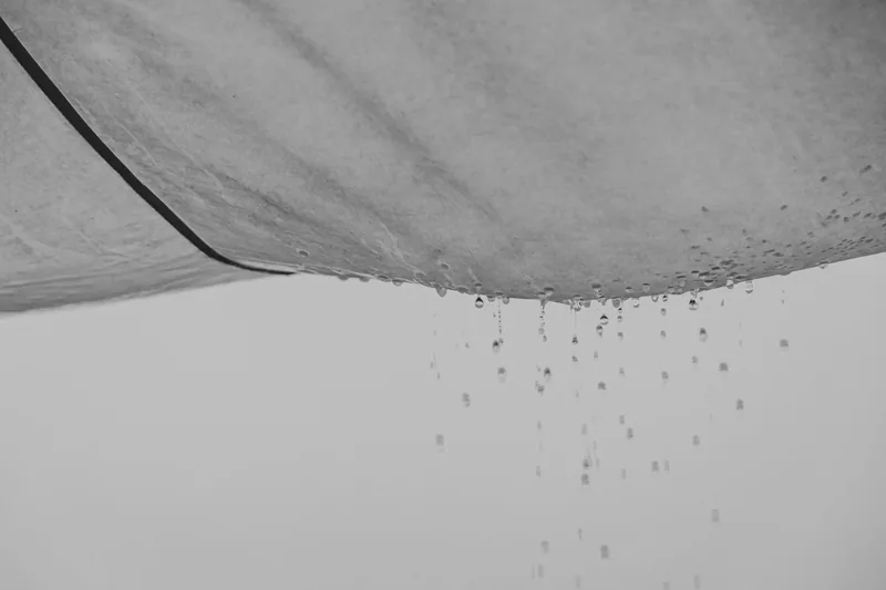 Water dripping through a stained ceiling
