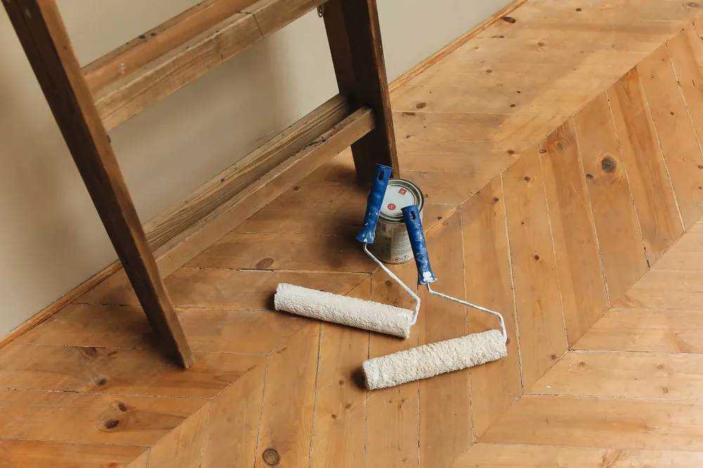 Finishing rollers resting on a new herringbone floor