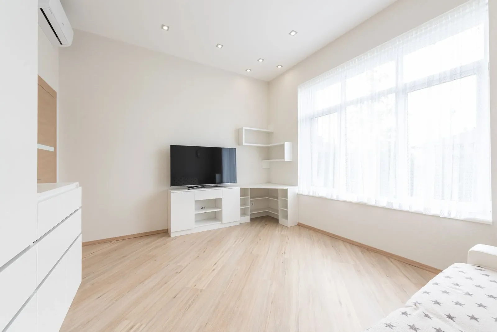 A bright living room with wire brushed white oak floors