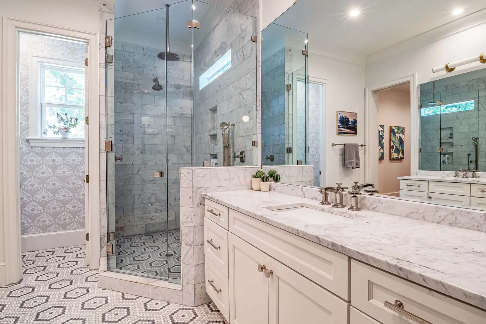 A bathroom with a porcelain hex tile floor