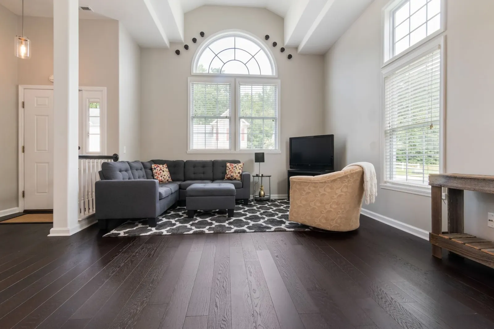 A family room with dark American walnut floors