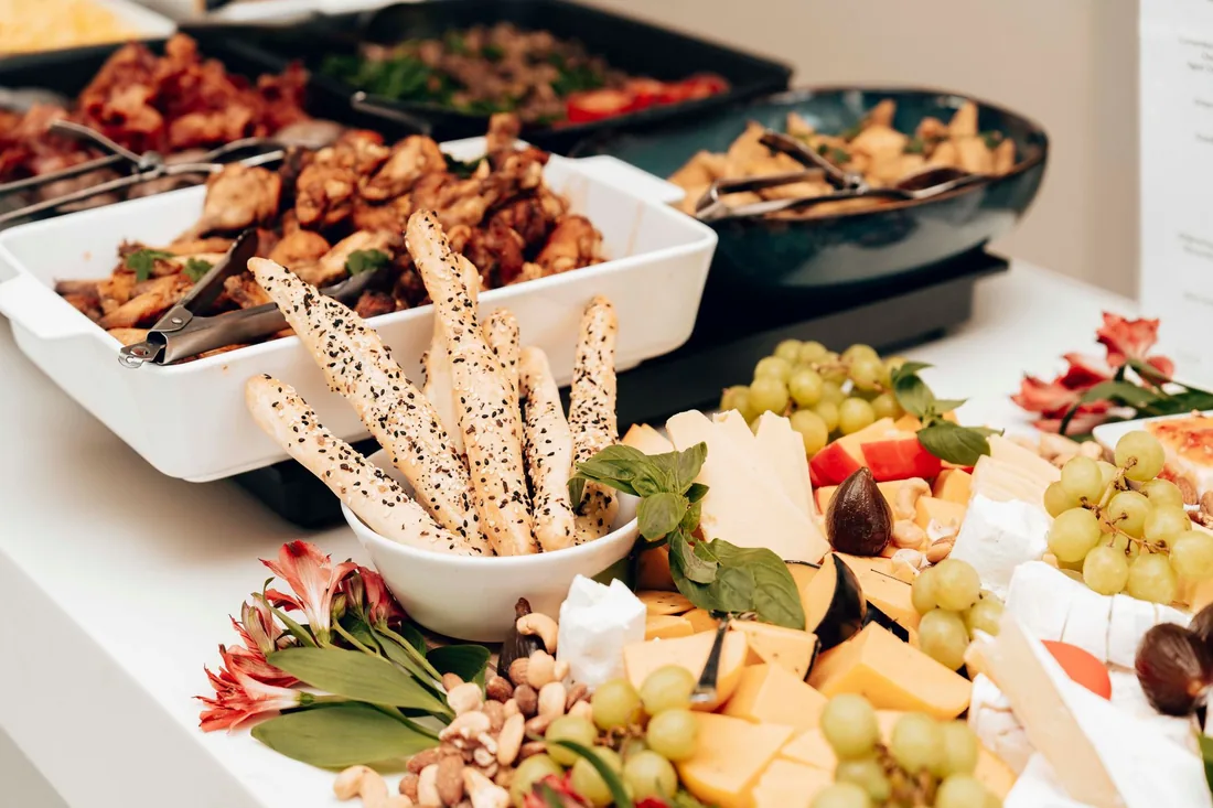 A drop-off catering spread on a long table