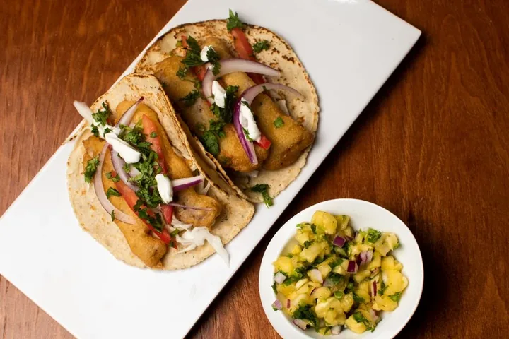 Two fish tacos with mango salsa