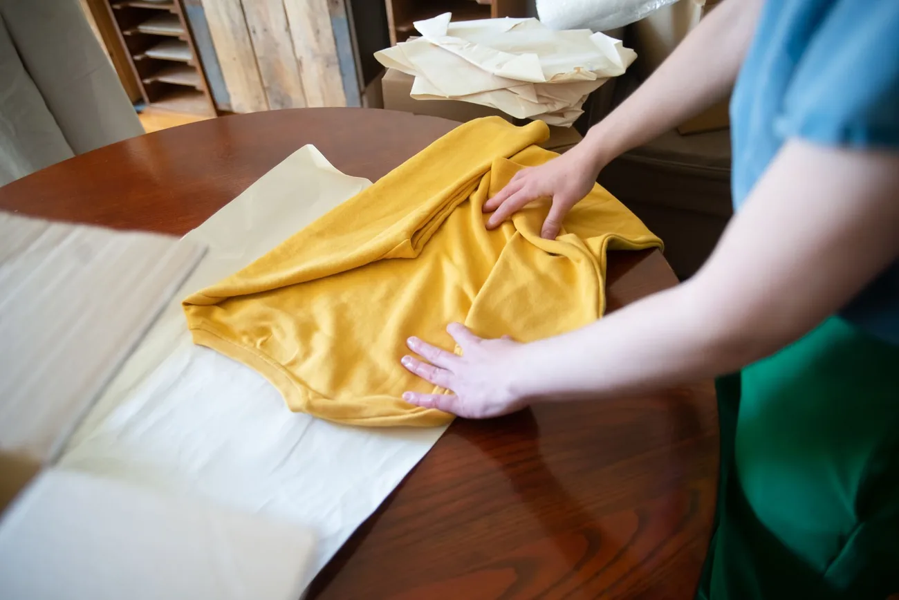 Laundry being folded on a counter