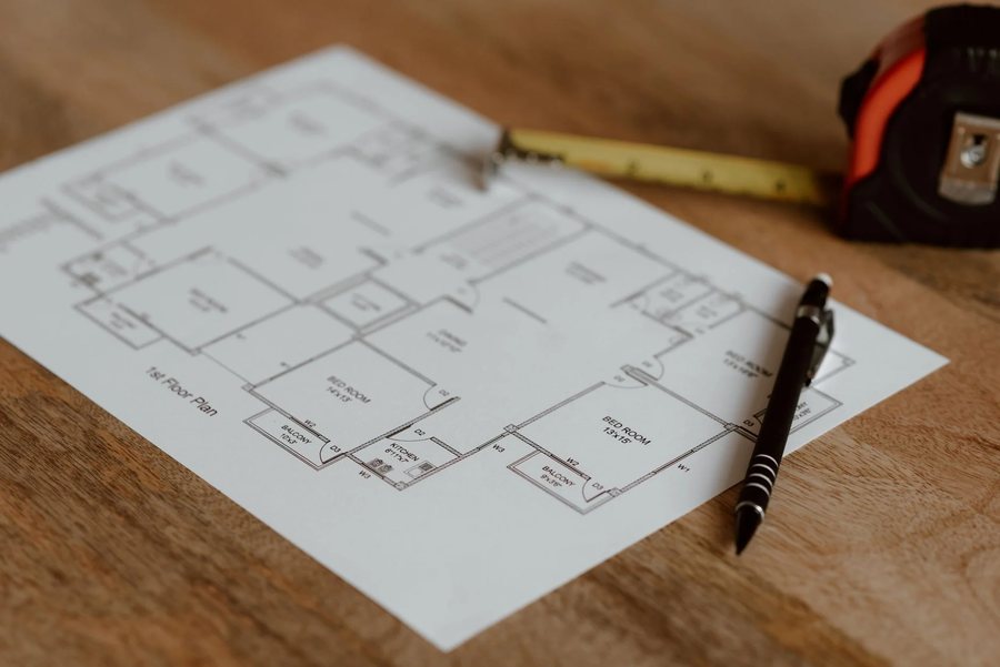 A floor plan with a tape measure
