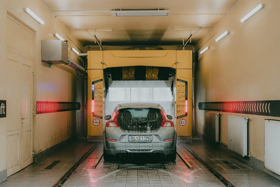 A car moving through the wash tunnel