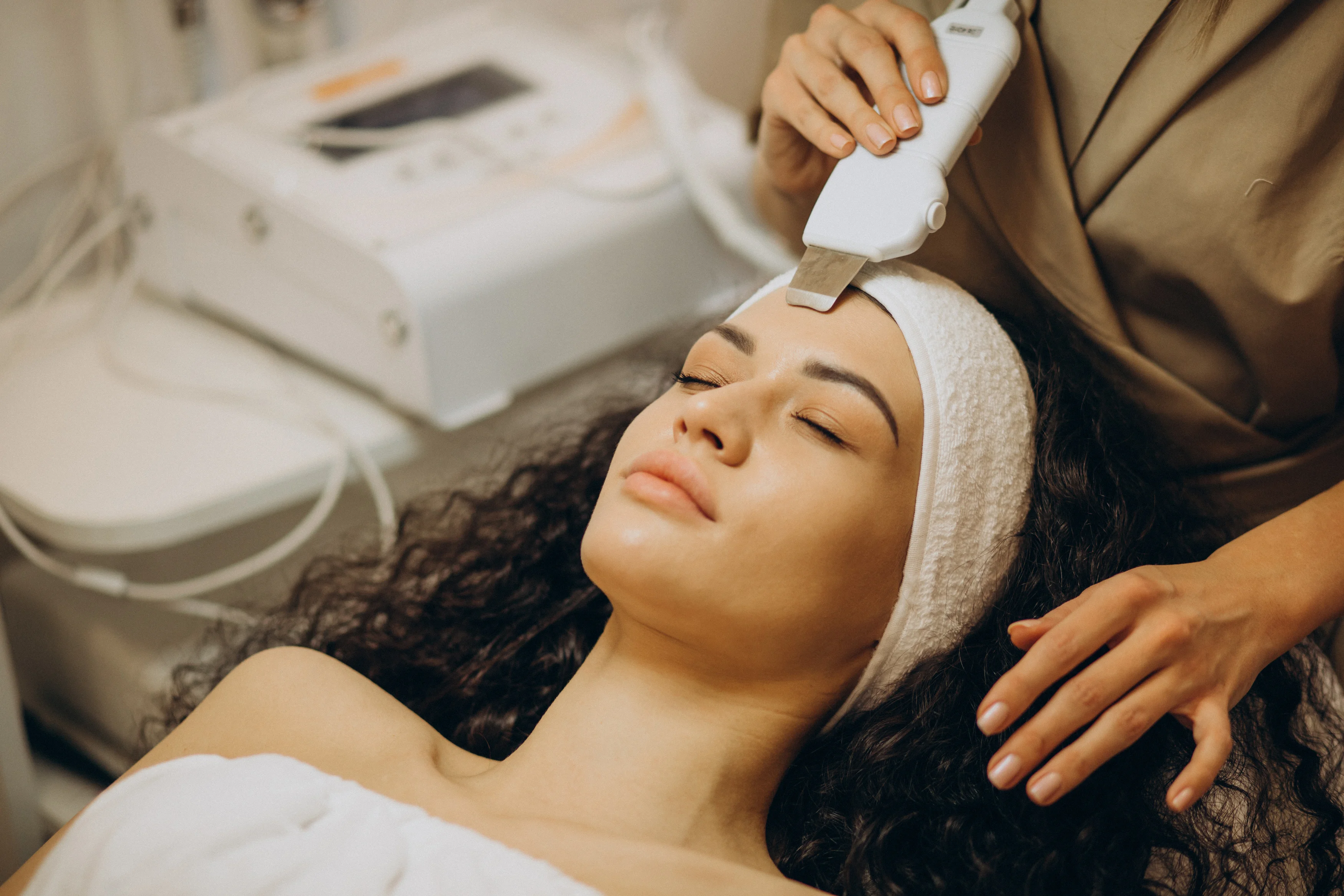 Client receiving a facial treatment at the spa