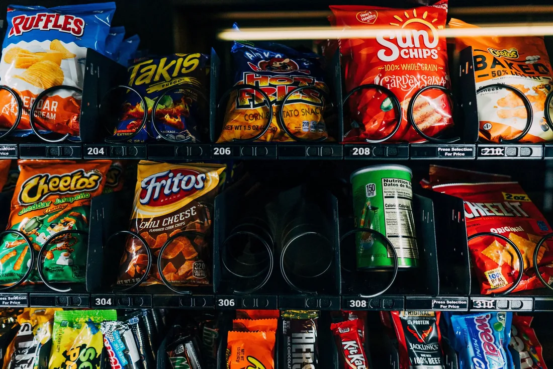 An open snack shelf in a staffed break room