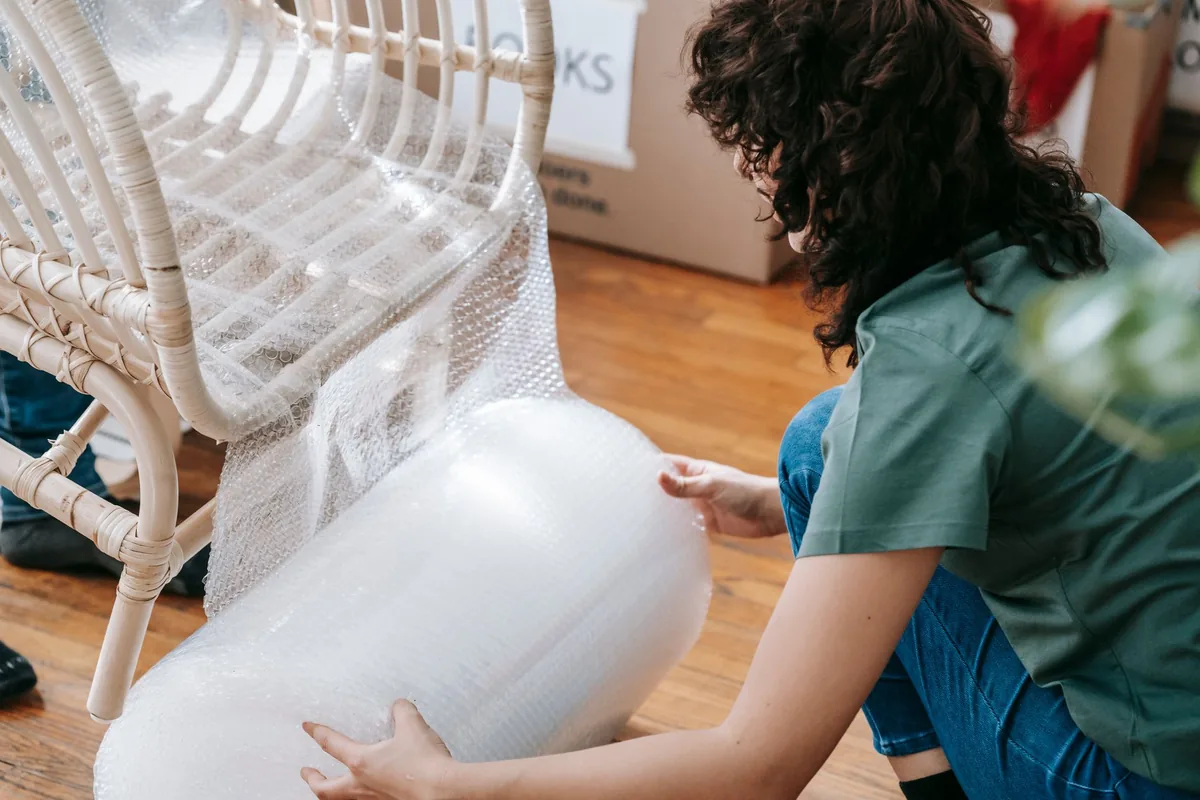 A chair being wrapped for transport