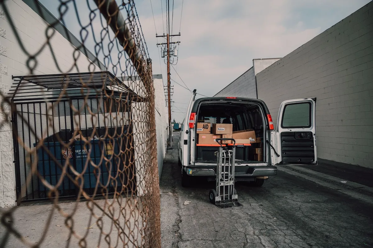 A van open in a street ready to load