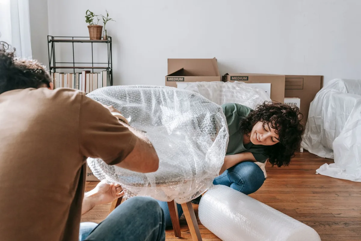 Fragile items being wrapped for transport
