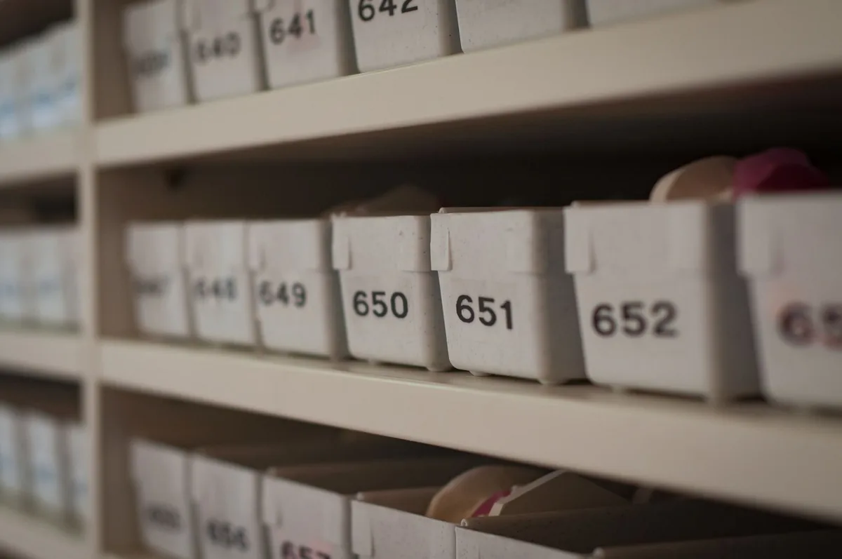 Numbered storage boxes on shelving