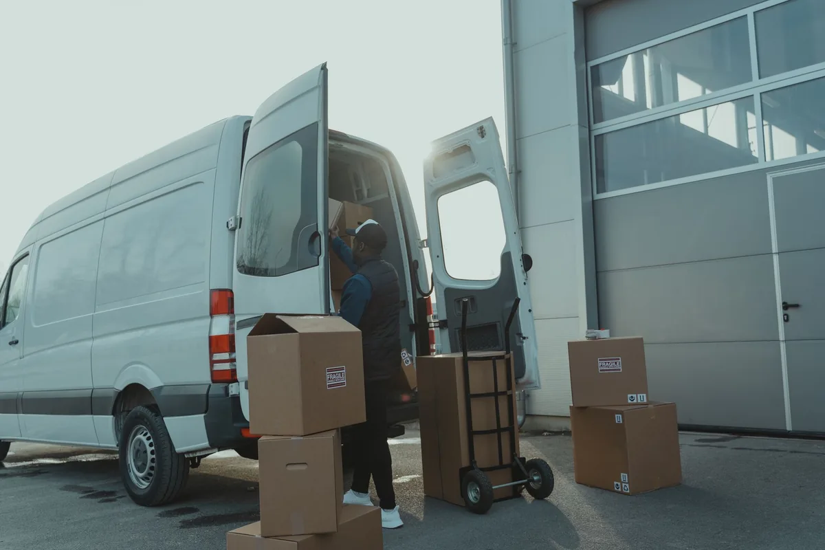 A van being loaded outside a unit