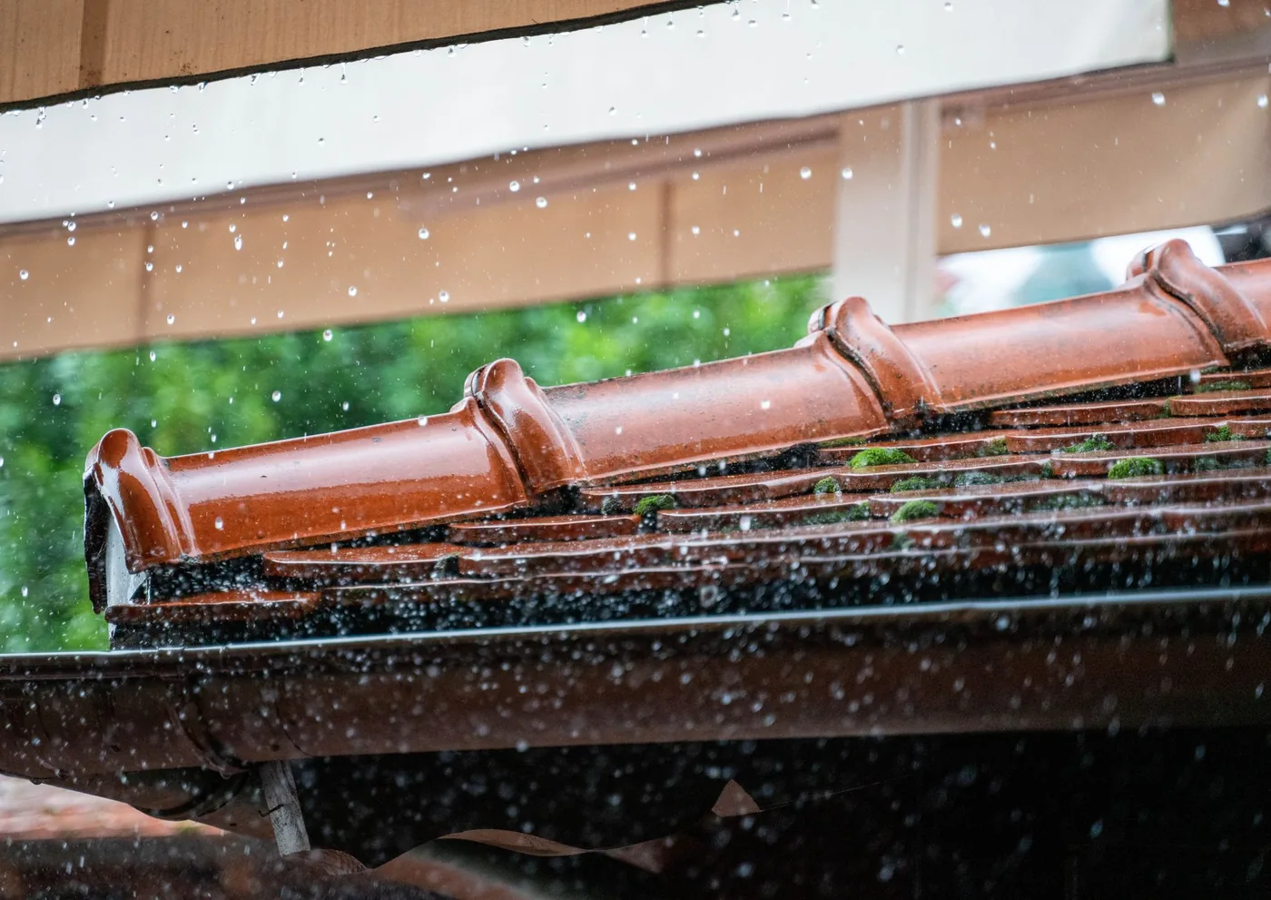 Close view of water pouring from a gutter