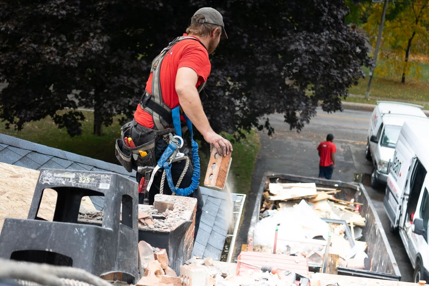 Operative loading cleared debris into a truck
