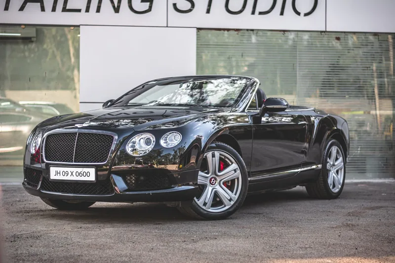A black convertible with tinted windows