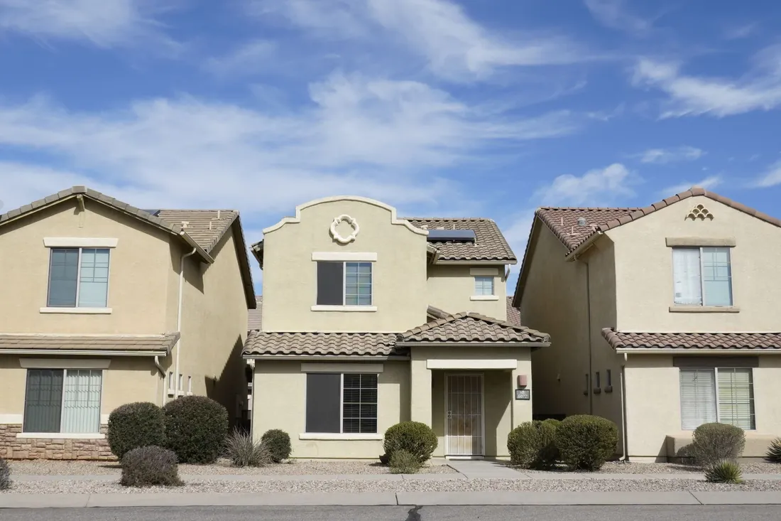 Stucco family homes with tile roofs