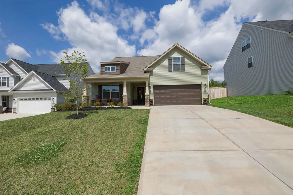 A finished driveway leading up to a house